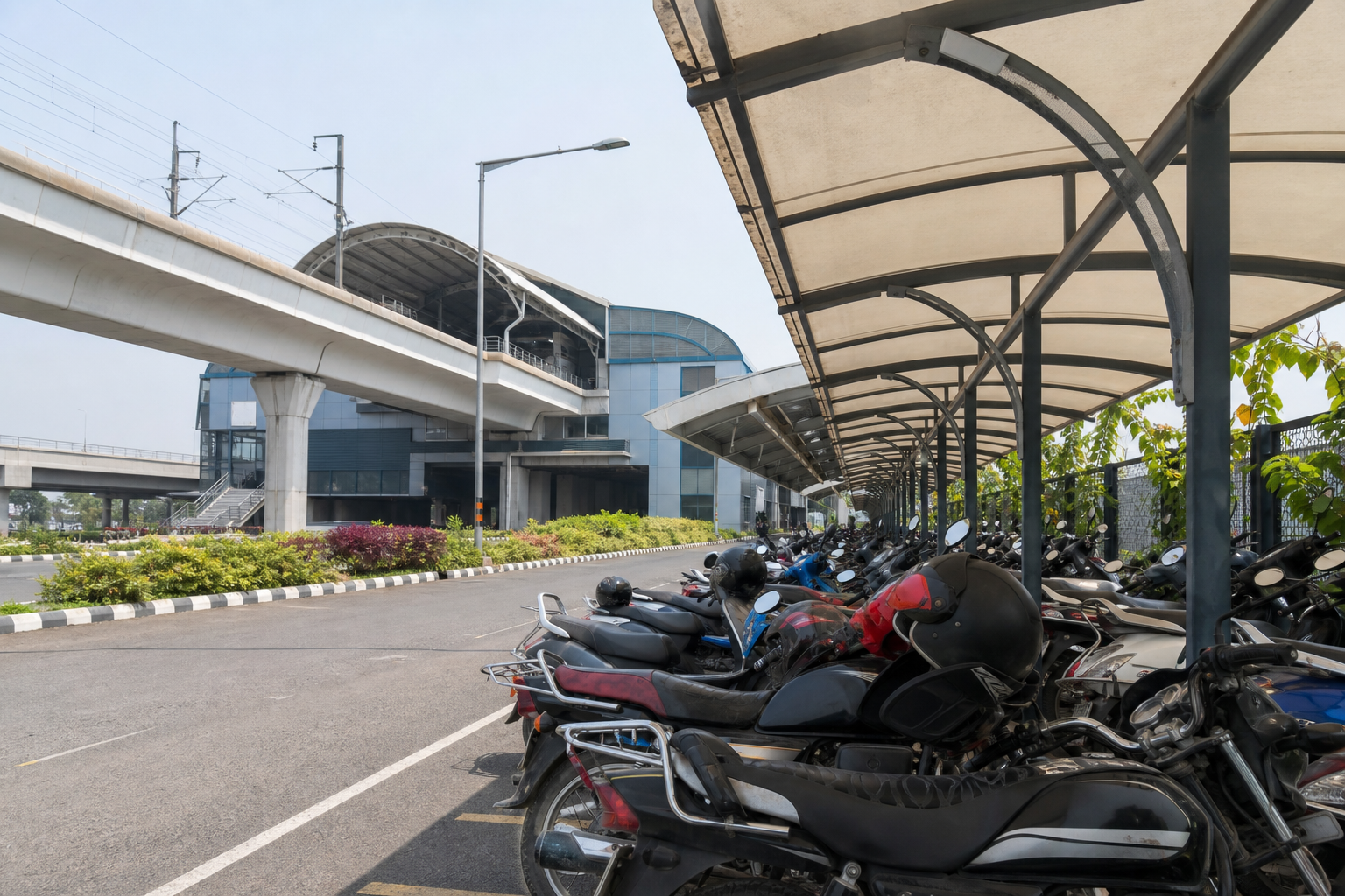 Two wheeler parking beside an Agra Metro station